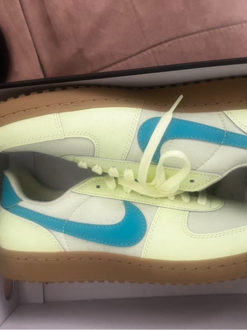 Nike Low-Top Sneakers with Blue Swoosh and Pale Yellow Upper